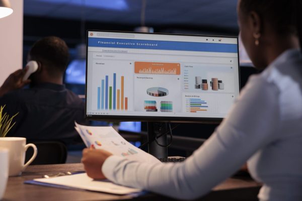 office-employee-analyzing-business-charts-on-compu-2023-11-27-04-56-07-utc-scaled